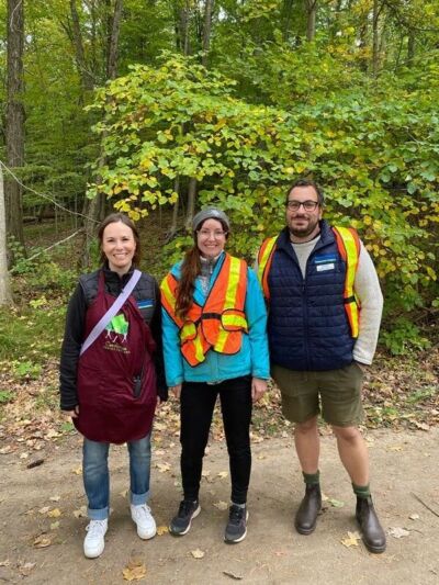 Three UTRCA staff standing in a line smiling