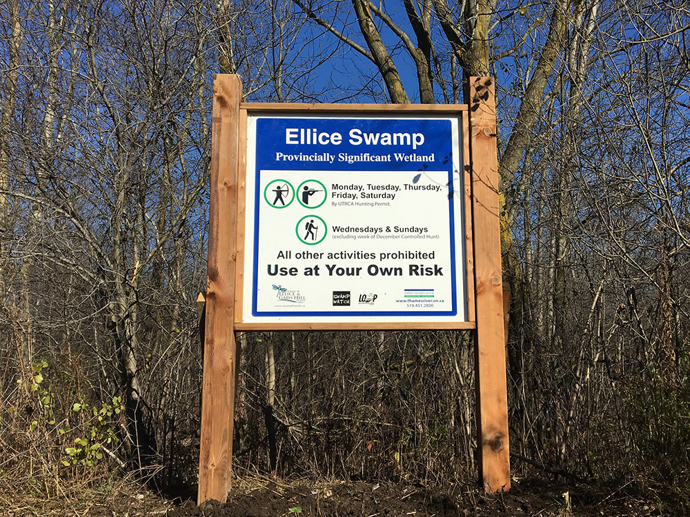 Large wood and metal sign at entrance to Ellice Swamp