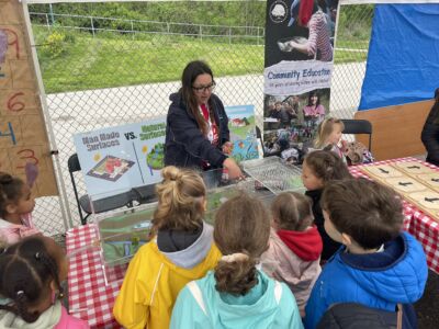 Children view a flood demonstration table
