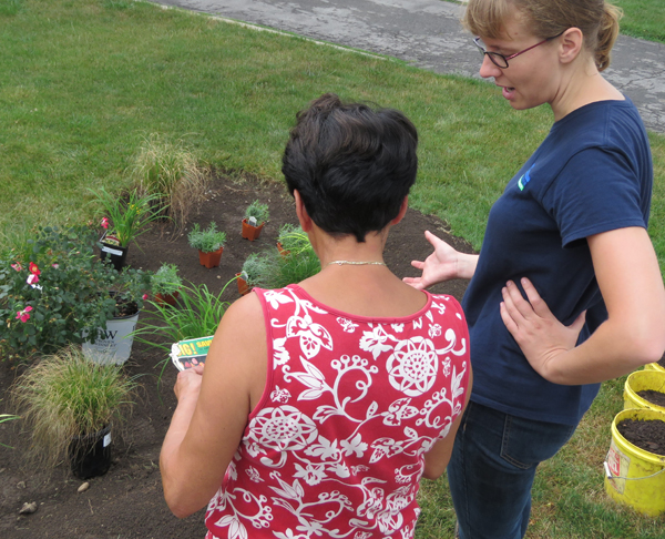 UTRCA staff and home owner with new rain garden