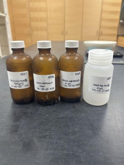 Four labeled sampling bottles