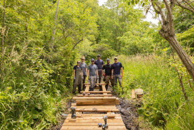 UTRCA staff standing on boardwalk mid-construction