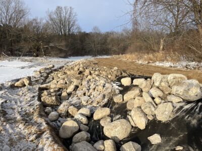 Large stones lining the shoreline